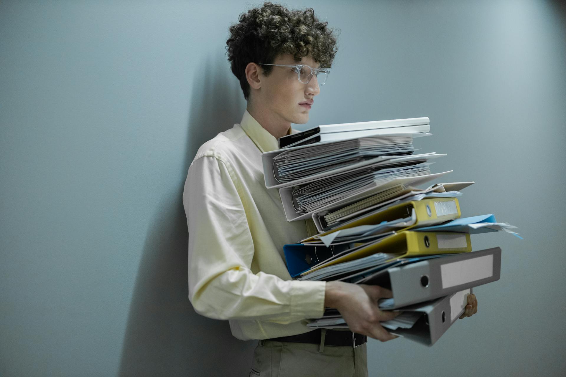 man holding HR files
